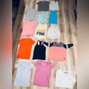 Pink assortment of t shirts and tanks. Mostly Medium but a few Large. From 2009s